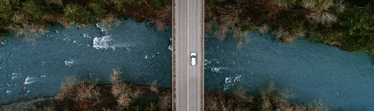 Car driving on road from above